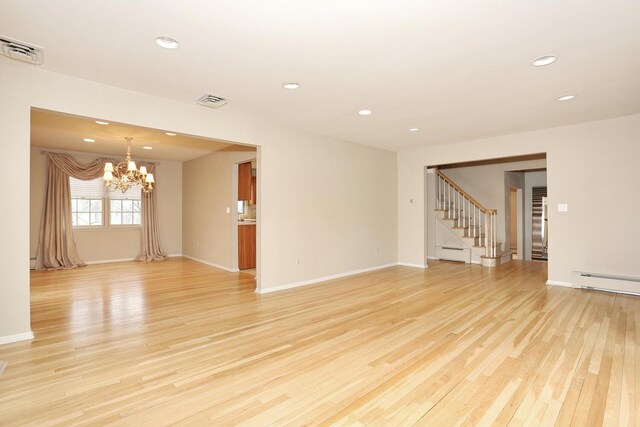 unfurnished room featuring recessed lighting, a notable chandelier, visible vents, and light wood finished floors