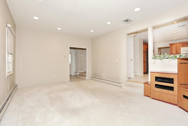 unfurnished living room featuring light colored carpet, baseboard heating, visible vents, recessed lighting, and a baseboard heating unit