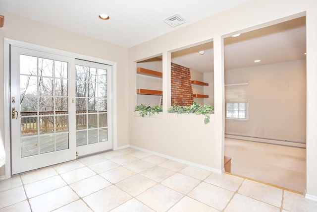 empty room with recessed lighting, baseboards, a baseboard heating unit, and visible vents