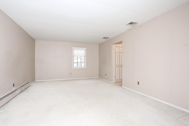 spare room featuring visible vents, a baseboard radiator, baseboards, and light colored carpet