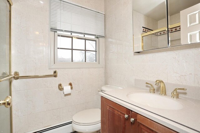 full bathroom featuring vanity, toilet, tile walls, a baseboard heating unit, and a tile shower