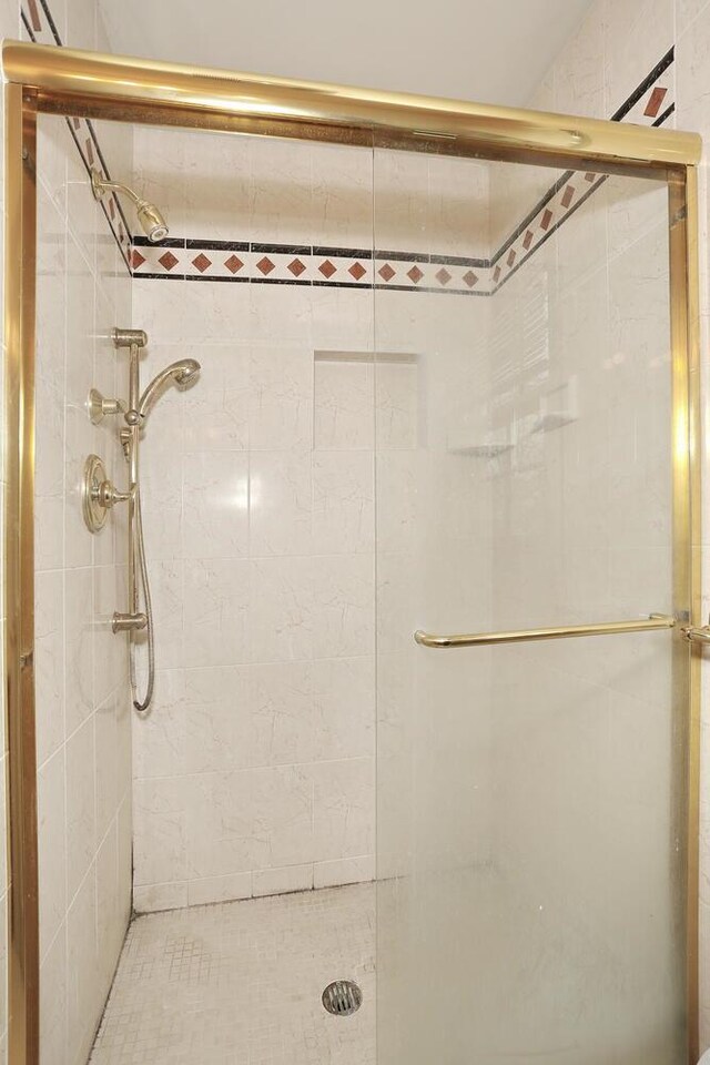 bathroom with a shower stall