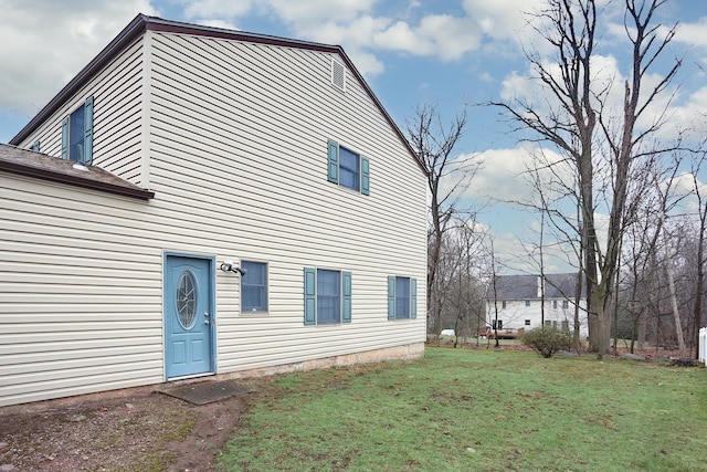 view of home's exterior featuring a yard