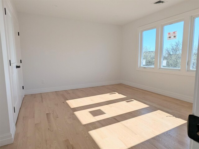 1135 Logan Rd, Wantagh, NY 11793 - empty room with light wood-type flooring