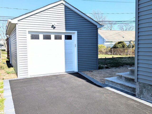 1135 Logan Rd, Wantagh, NY 11793 - detached garage featuring asphalt driveway