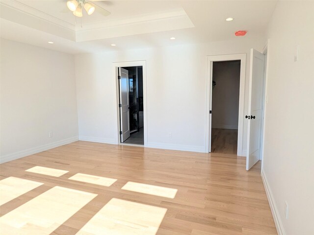 1135 Logan Rd, Wantagh, NY 11793 - unfurnished room featuring light wood-style flooring, ceiling fan, recessed lighting, a raised ceiling, and baseboards