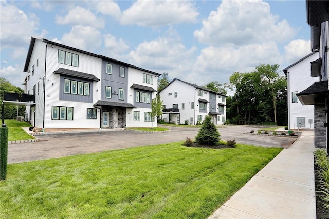 exterior space with a yard and a residential view
