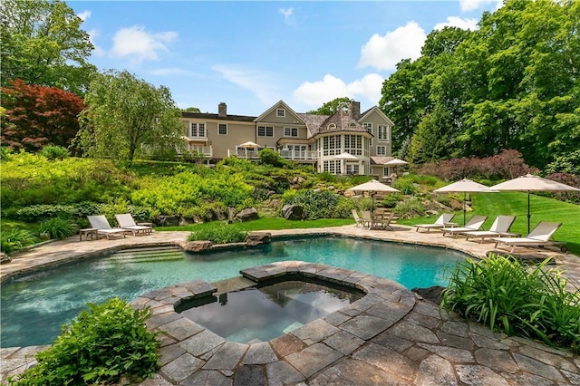70 Haights Cross Rd, Chappaqua, NY 10514 - view of swimming pool with a patio and a pool with connected hot tub