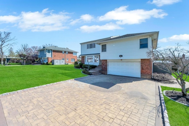 34 Duke Dr, Manhasset Hills, NY 11040 - view of front facade with a front lawn, brick siding, decorative driveway, and a garage