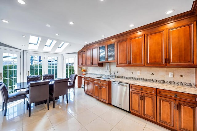 34 Duke Dr, Manhasset Hills, NY 11040 - kitchen with light stone counters, a sink, brown cabinets, decorative backsplash, and dishwasher