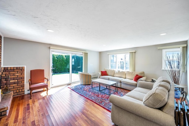 34 Duke Dr, Manhasset Hills, NY 11040 - living room featuring a healthy amount of sunlight, wood finished floors, and recessed lighting
