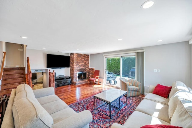 34 Duke Dr, Manhasset Hills, NY 11040 - living room with stairway, a fireplace, wood finished floors, and recessed lighting