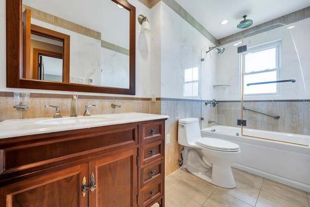 34 Duke Dr, Manhasset Hills, NY 11040 - full bathroom featuring tile patterned floors, vanity, tile walls, enclosed tub / shower combo, and toilet