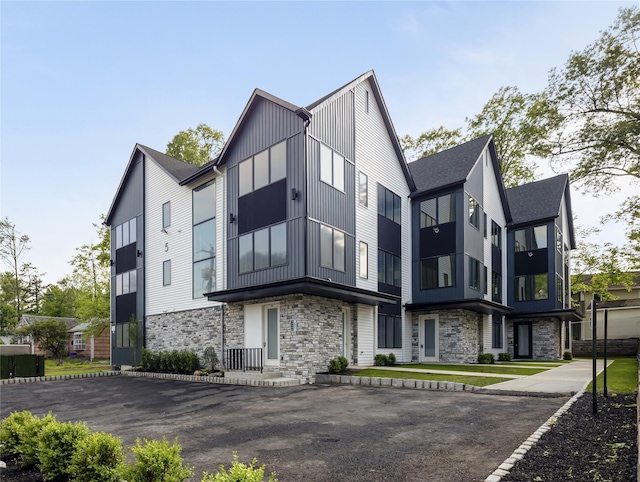 5 Francis Pl Unit 214, Monsey, NY 10952 - view of front facade with stone siding, board and batten siding, and roof with shingles