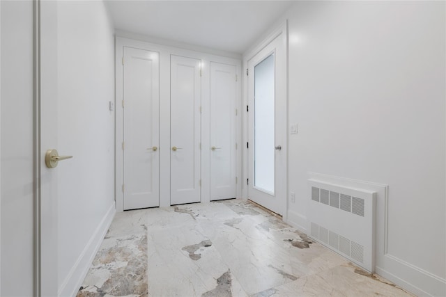 5 Francis Pl Unit 214, Monsey, NY 10952 - unfurnished bedroom with radiator and light marble finish flooring