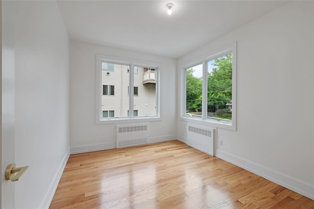 5 Francis Pl Unit 214, Monsey, NY 10952 - empty room featuring radiator heating unit and light wood-style flooring