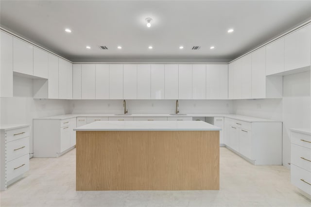 5 Francis Pl Unit 214, Monsey, NY 10952 - kitchen featuring a kitchen island, modern cabinets, white cabinets, and recessed lighting
