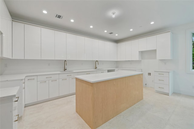 5 Francis Pl Unit 214, Monsey, NY 10952 - kitchen featuring modern cabinets, a kitchen island, recessed lighting, and white cabinets