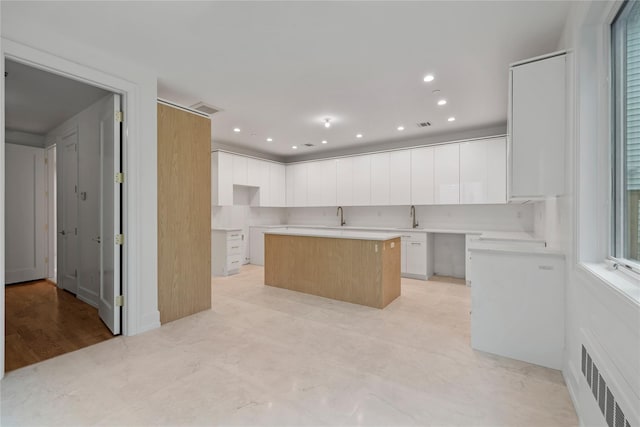 5 Francis Pl Unit 214, Monsey, NY 10952 - kitchen featuring a center island, white cabinets, and recessed lighting