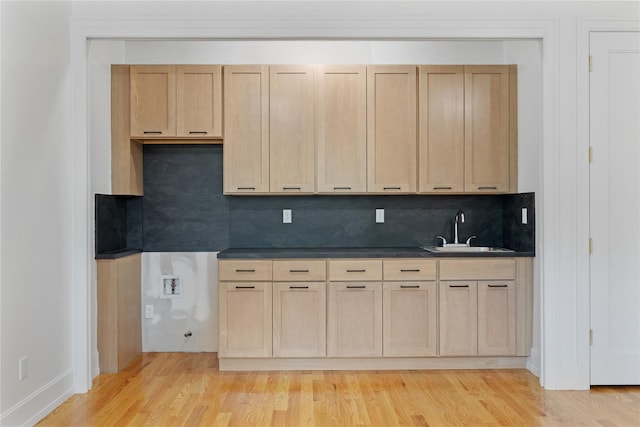 5 Francis Pl Unit 214, Monsey, NY 10952 - kitchen with light wood finished floors, dark countertops, tasteful backsplash, and light brown cabinets