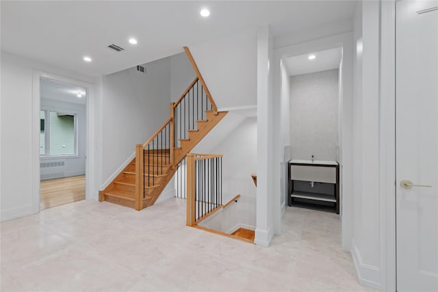 5 Francis Pl Unit 214, Monsey, NY 10952 - staircase featuring radiator heating unit and recessed lighting