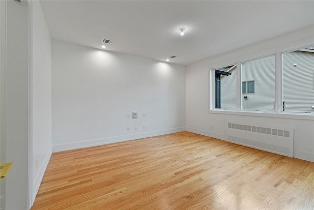5 Francis Pl Unit 214, Monsey, NY 10952 - empty room with radiator heating unit, light wood-type flooring, and recessed lighting