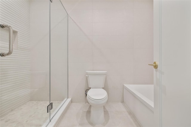 5 Francis Pl Unit 214, Monsey, NY 10952 - bathroom featuring tile walls, a shower, a bathtub, and tile patterned flooring