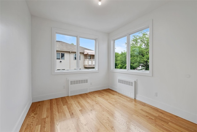 5 Francis Pl Unit 214, Monsey, NY 10952 - empty room featuring radiator heating unit and wood finished floors
