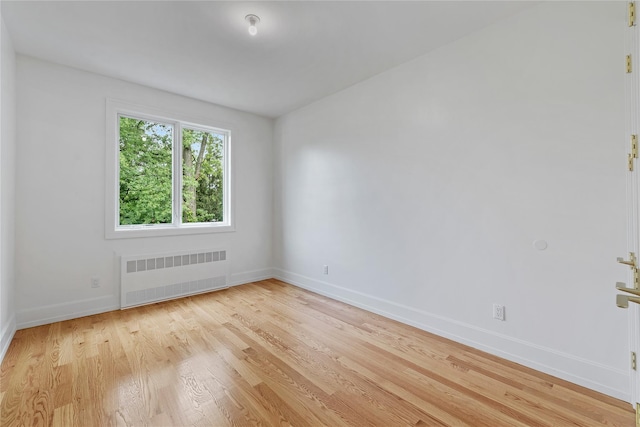 5 Francis Pl Unit 214, Monsey, NY 10952 - spare room featuring radiator and light wood-style flooring