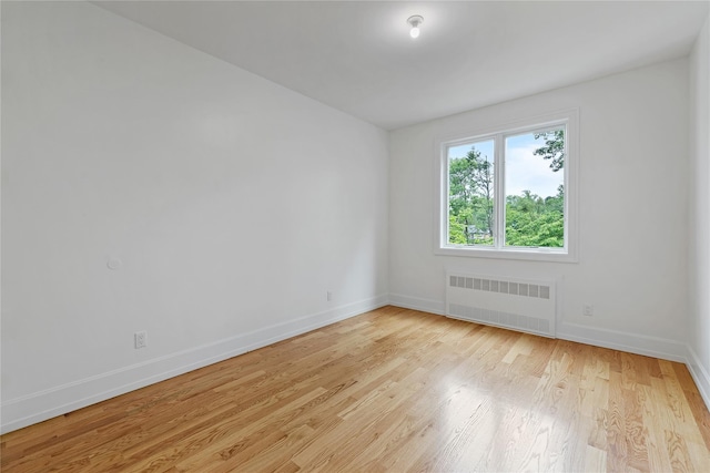 5 Francis Pl Unit 214, Monsey, NY 10952 - unfurnished room with radiator heating unit and light wood-type flooring
