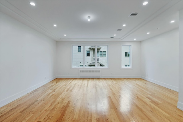 5 Francis Pl Unit 214, Monsey, NY 10952 - empty room with radiator heating unit, light wood-style flooring, recessed lighting, and ornamental molding