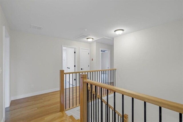 LOT2 Lakes Rd, Monroe, NY 10950 - hall featuring attic access, visible vents, baseboards, an upstairs landing, and light wood-style floors