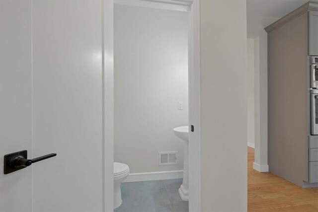 LOT2 Lakes Rd, Monroe, NY 10950 - bathroom featuring visible vents, baseboards, wood finished floors, and toilet