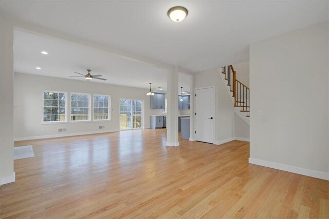 LOT2 Lakes Rd, Monroe, NY 10950 - unfurnished living room featuring a ceiling fan, baseboards, stairway, and light wood-type flooring