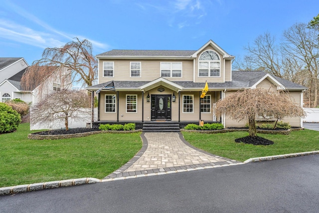 6 Premier Ct, Port Jefferson Station, NY 11776 - view of front of house featuring a shingled roof and a front lawn