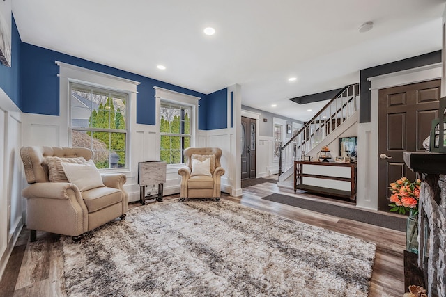 6 Premier Ct, Port Jefferson Station, NY 11776 - sitting room with wood finished floors, recessed lighting, a decorative wall, and stairs