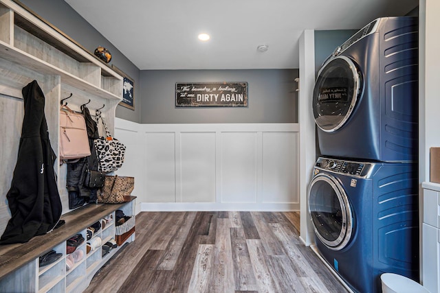 6 Premier Ct, Port Jefferson Station, NY 11776 - washroom with stacked washer and dryer, wainscoting, laundry area, a decorative wall, and wood finished floors