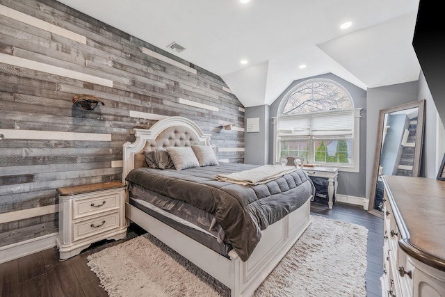 6 Premier Ct, Port Jefferson Station, NY 11776 - bedroom with baseboards, vaulted ceiling, wooden walls, an accent wall, and dark wood finished floors