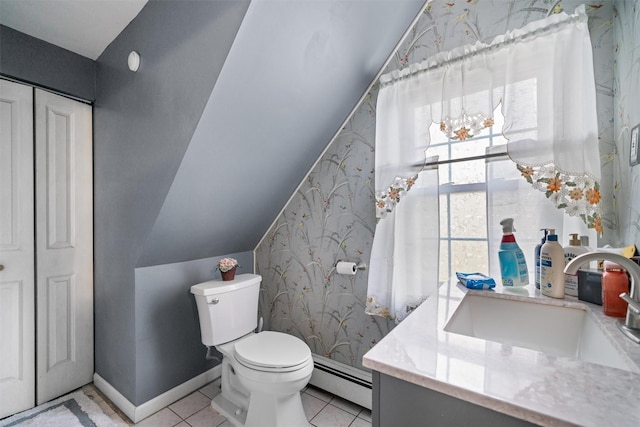 bathroom with vanity, a baseboard heating unit, wallpapered walls, and toilet