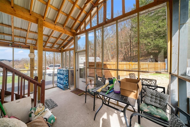 sunroom / solarium featuring outdoor dining space