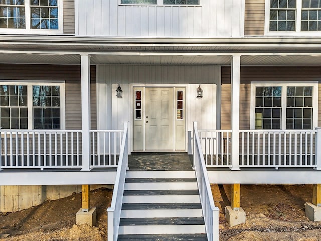 entrance to property featuring a porch