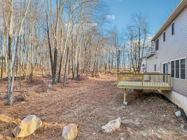 view of yard featuring a wooden deck