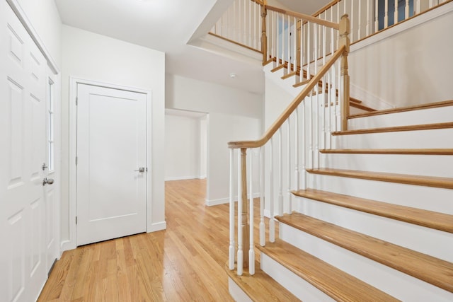 staircase featuring wood finished floors