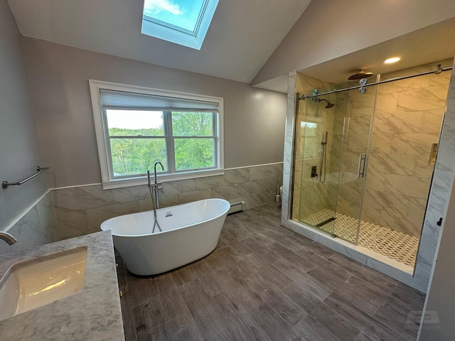 107 Denniston Dr, New Windsor, NY 12553 - full bathroom with tile walls, vaulted ceiling, a soaking tub, a shower stall, and a sink