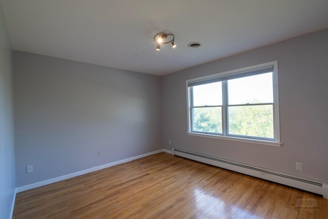 107 Denniston Dr, New Windsor, NY 12553 - spare room featuring a baseboard radiator, wood finished floors, and baseboards