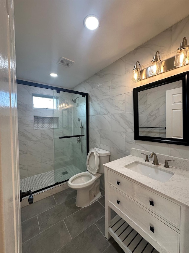 107 Denniston Dr, New Windsor, NY 12553 - bathroom featuring a shower stall, toilet, tile walls, vanity, and recessed lighting