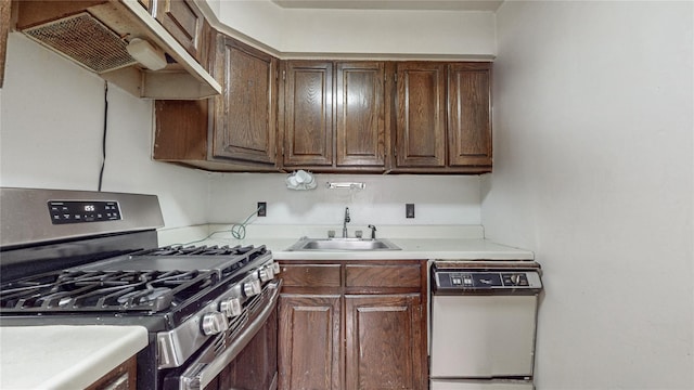 111-09 62nd Dr, Forest Hills, NY 11375 - kitchen with light countertops, under cabinet range hood, dishwasher, stainless steel range with gas stovetop, and a sink