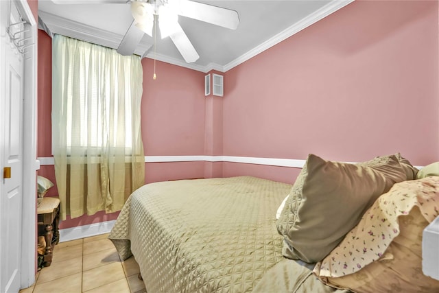tiled bedroom with crown molding and a ceiling fan