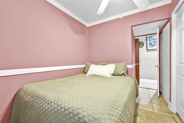 bedroom featuring ornamental molding, tile patterned floors, ceiling fan, and baseboards