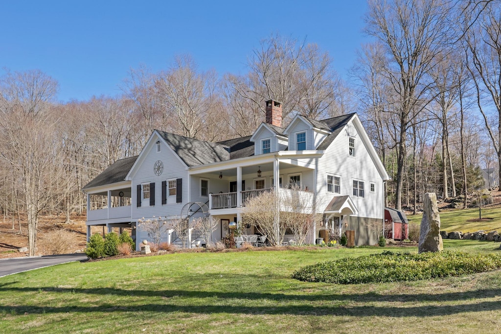 30 Benedict Rd, South Salem, NY 10590 - view of front of house featuring a front yard, a balcony, driveway, and a chimney